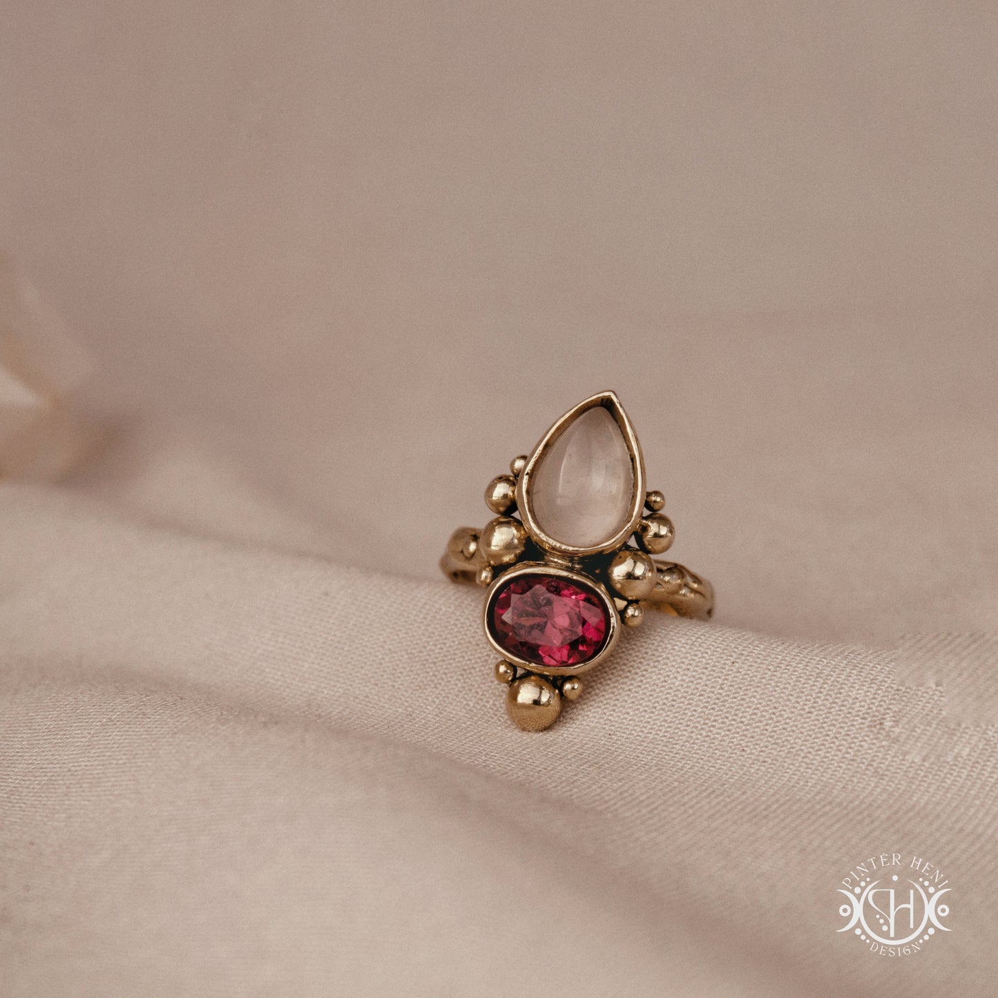 Handmade Korering with rose quartz and garnet in balanced sculptural setting