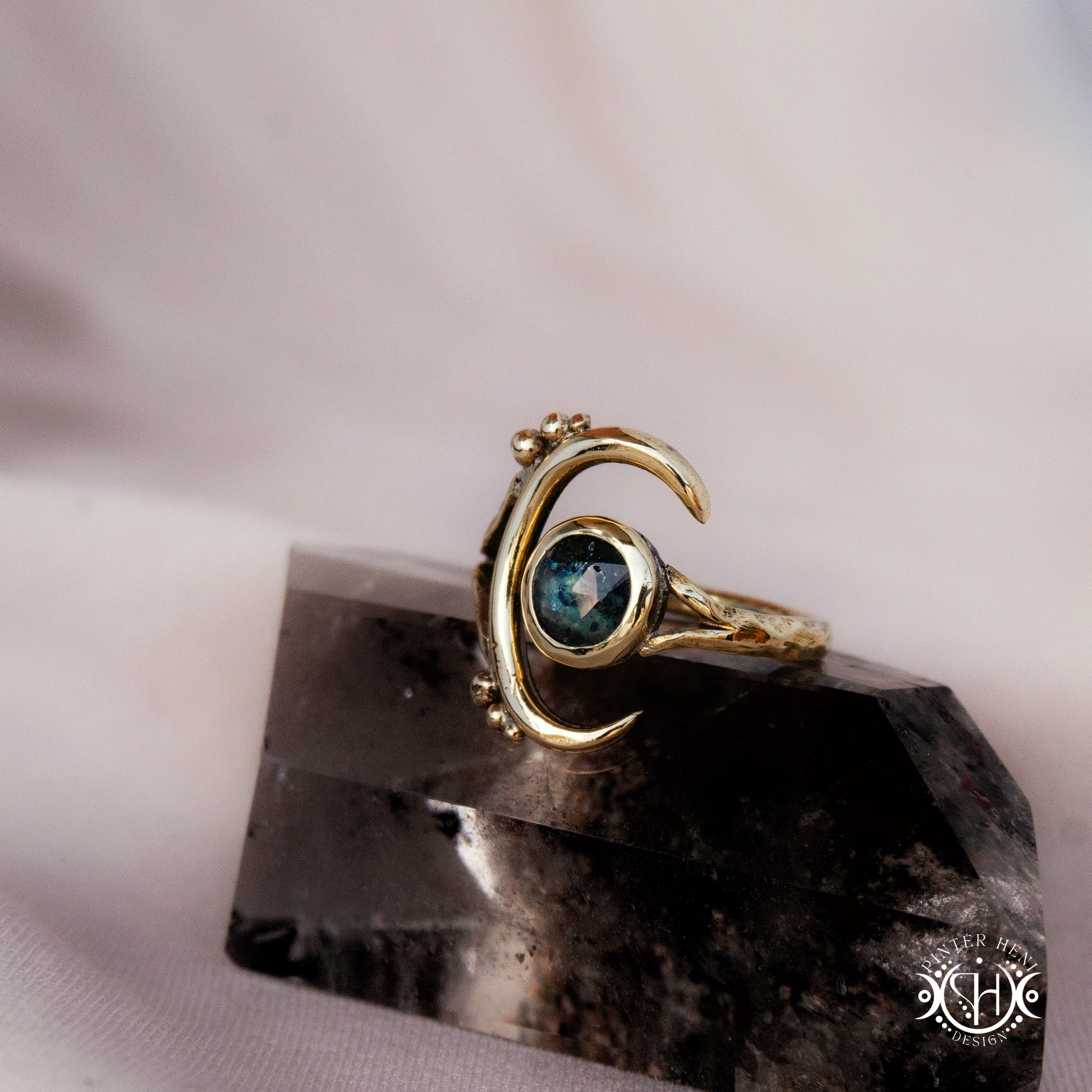 One-of-a-kind brass crescent ring with moss blue kyanite stone from the Skybound Awakening collection.
