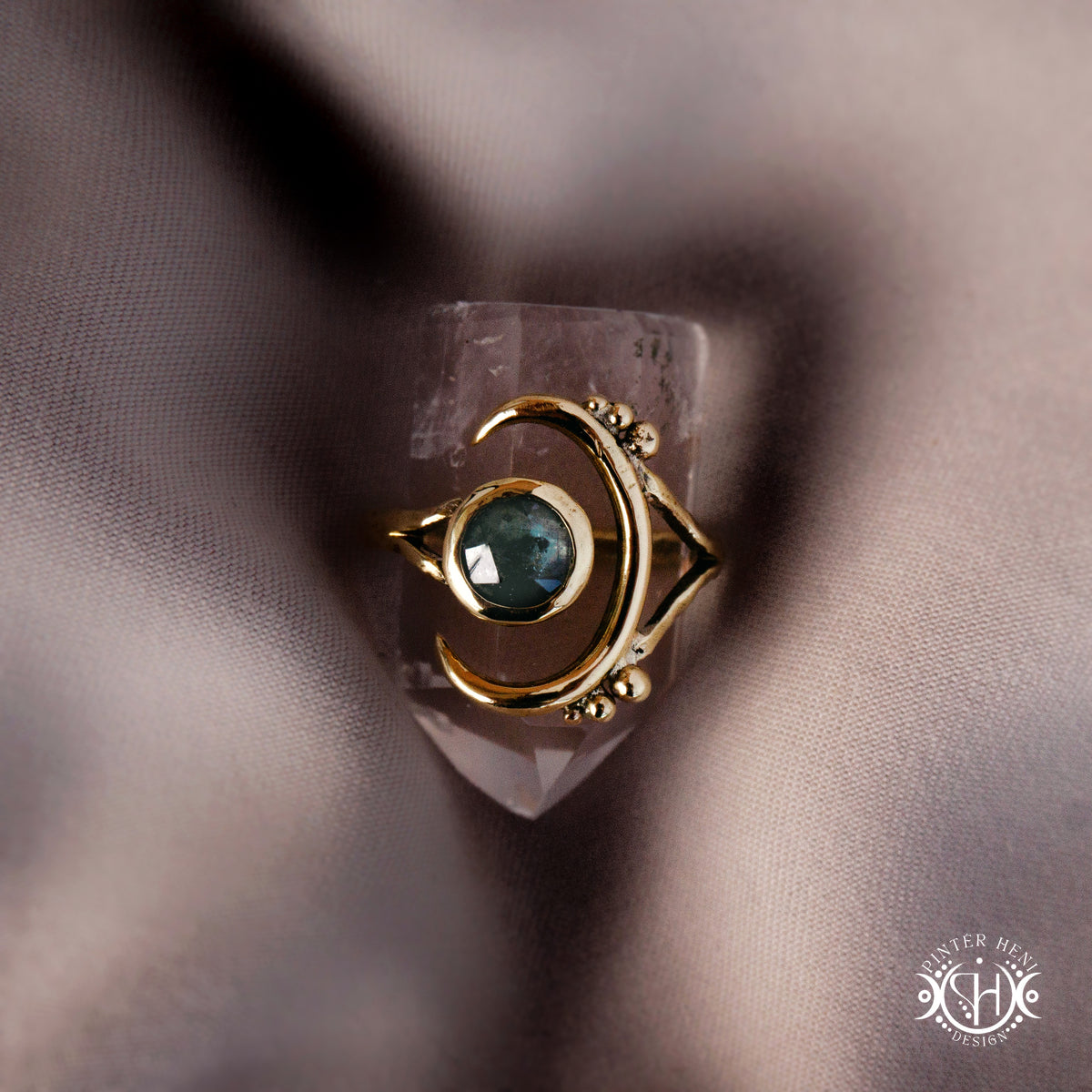 One-of-a-kind brass crescent ring with moss blue kyanite stone from the Skybound Awakening collection.