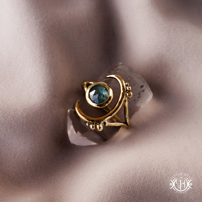 One-of-a-kind brass crescent ring with moss blue kyanite stone from the Skybound Awakening collection.