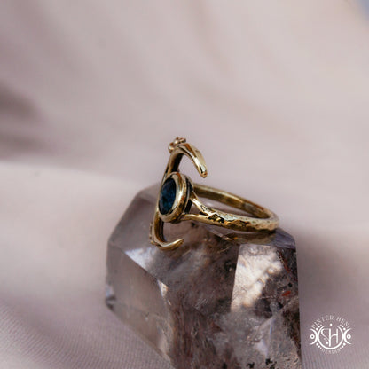 One-of-a-kind brass crescent ring with moss blue kyanite stone from the Skybound Awakening collection.