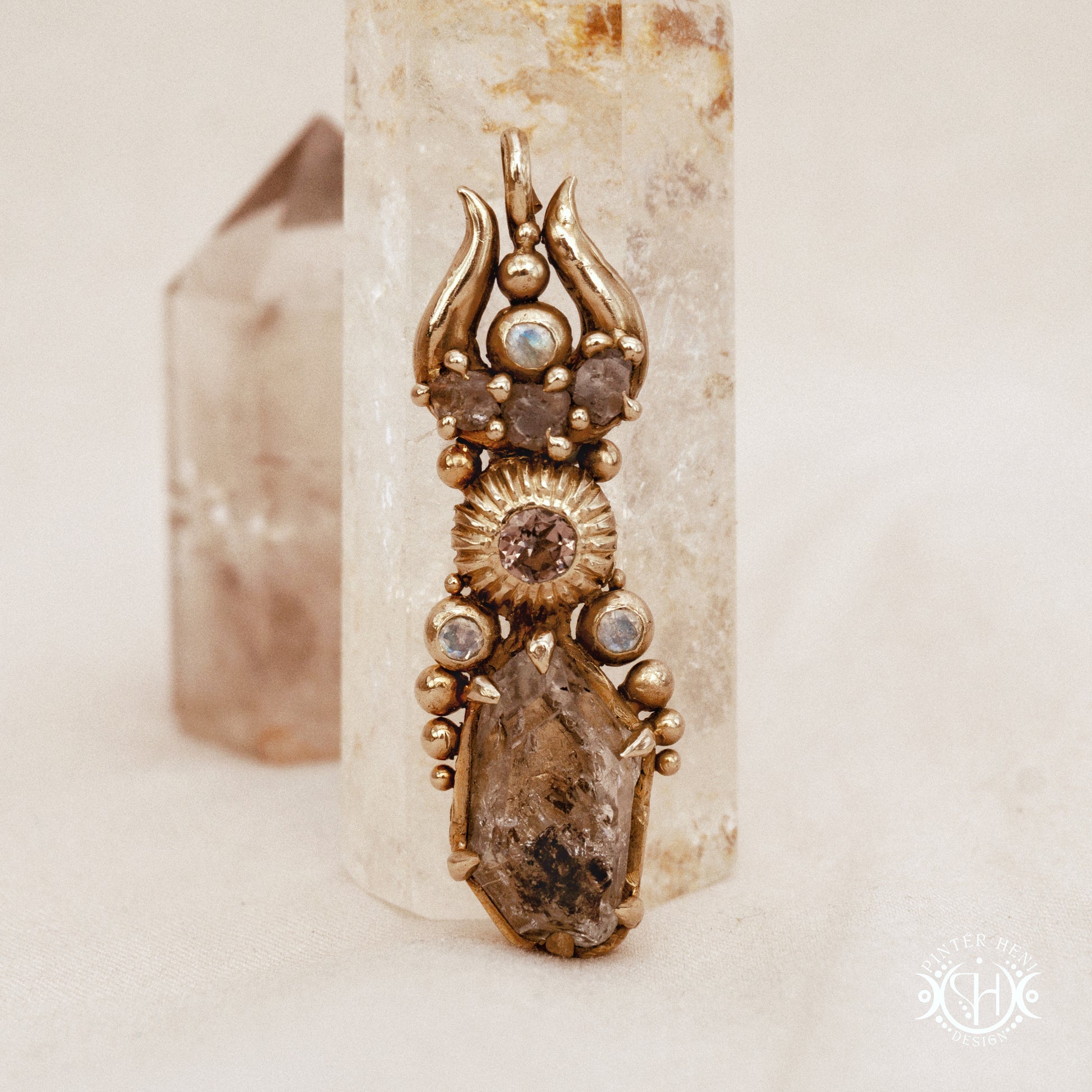 One of a kind Lunar Desert Rites pendant with crescent form, raw sapphire, pink tourmaline, moonstone and Herkimer crystal