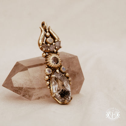 One of a kind Lunar Desert Rites pendant with crescent form, raw sapphire, pink tourmaline, moonstone and Herkimer crystal