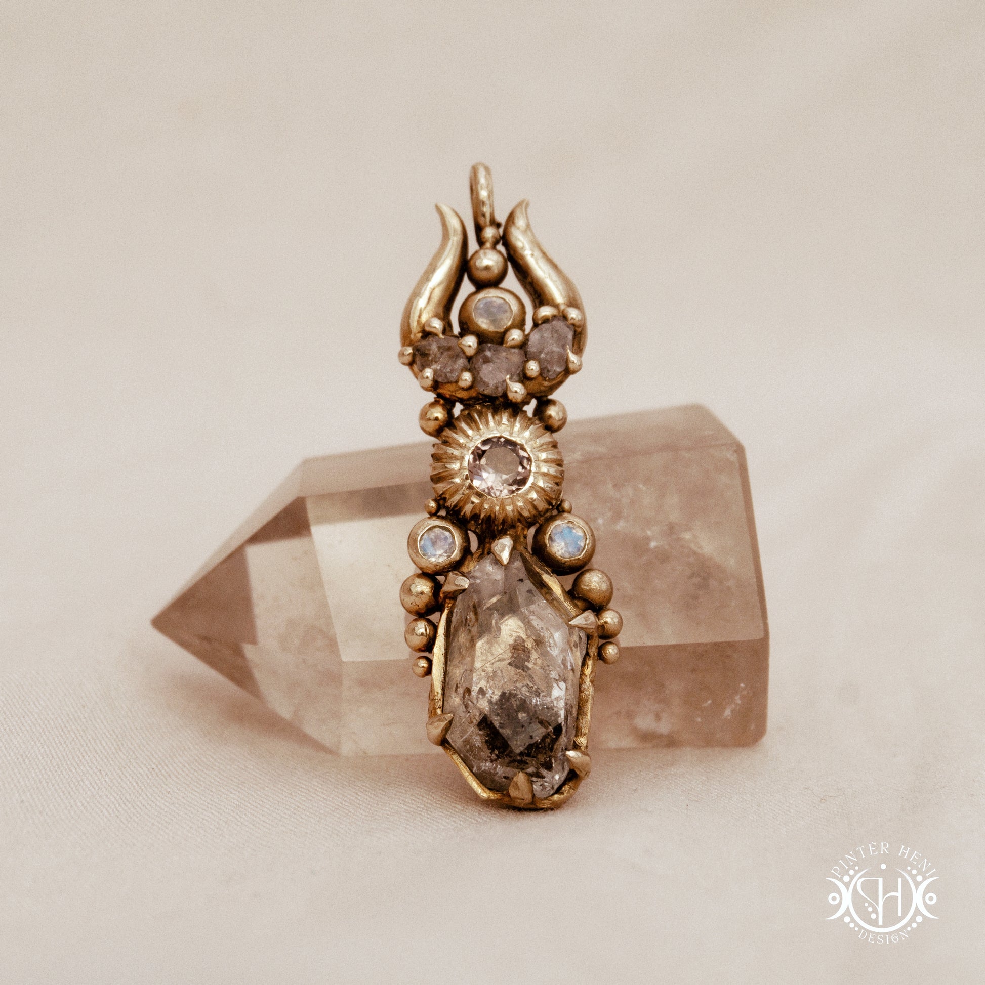 One of a kind Lunar Desert Rites pendant with crescent form, raw sapphire, pink tourmaline, moonstone and Herkimer crystal