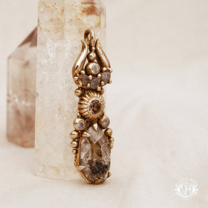 One of a kind Lunar Desert Rites pendant with crescent form, raw sapphire, pink tourmaline, moonstone and Herkimer crystal