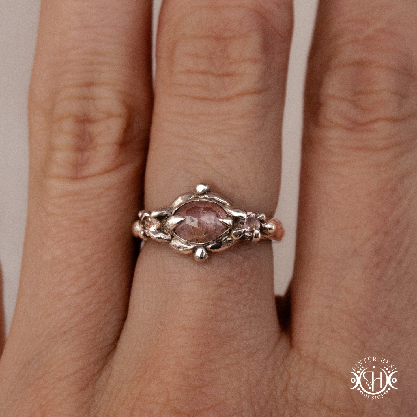 Sterling silver organic ring with pink Burma spinel and pink tourmaline in sculptural setting.