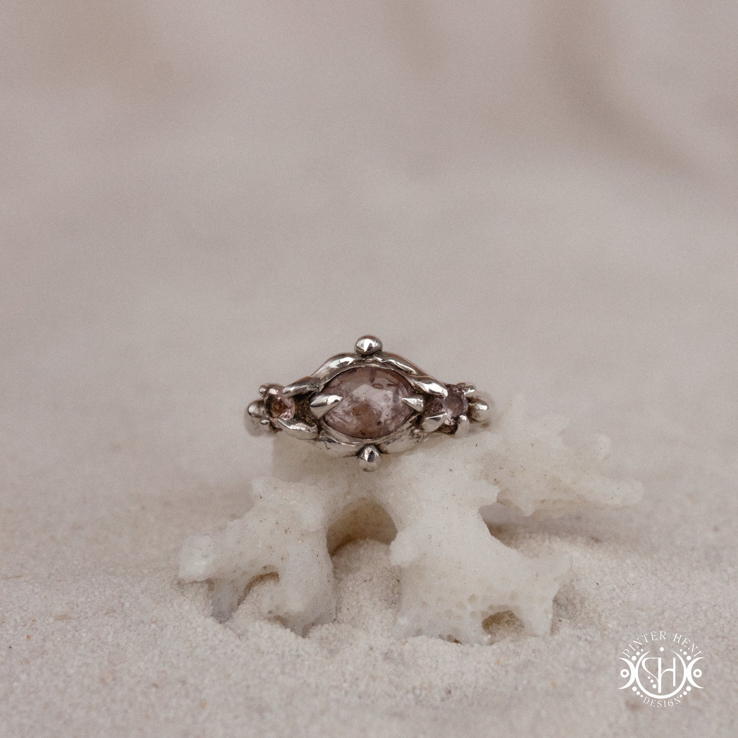 Sterling silver organic ring with pink Burma spinel and pink tourmaline in sculptural setting.
