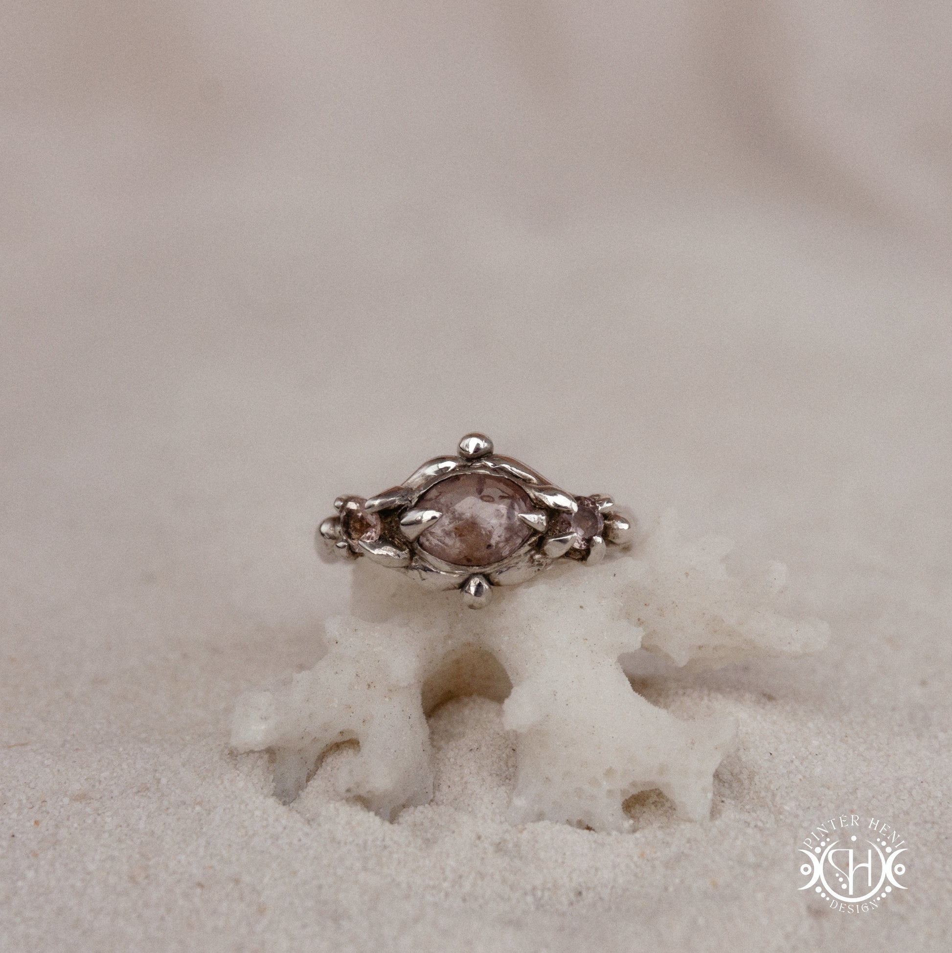 Sterling silver organic ring with pink Burma spinel and pink tourmaline in sculptural setting.
