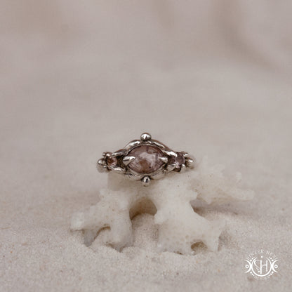 Sterling silver organic ring with pink Burma spinel and pink tourmaline in sculptural setting.
