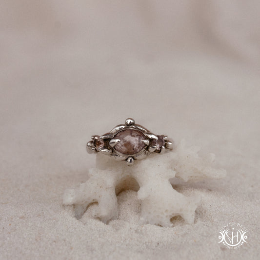 Sterling silver organic ring with pink Burma spinel and pink tourmaline in sculptural setting.
