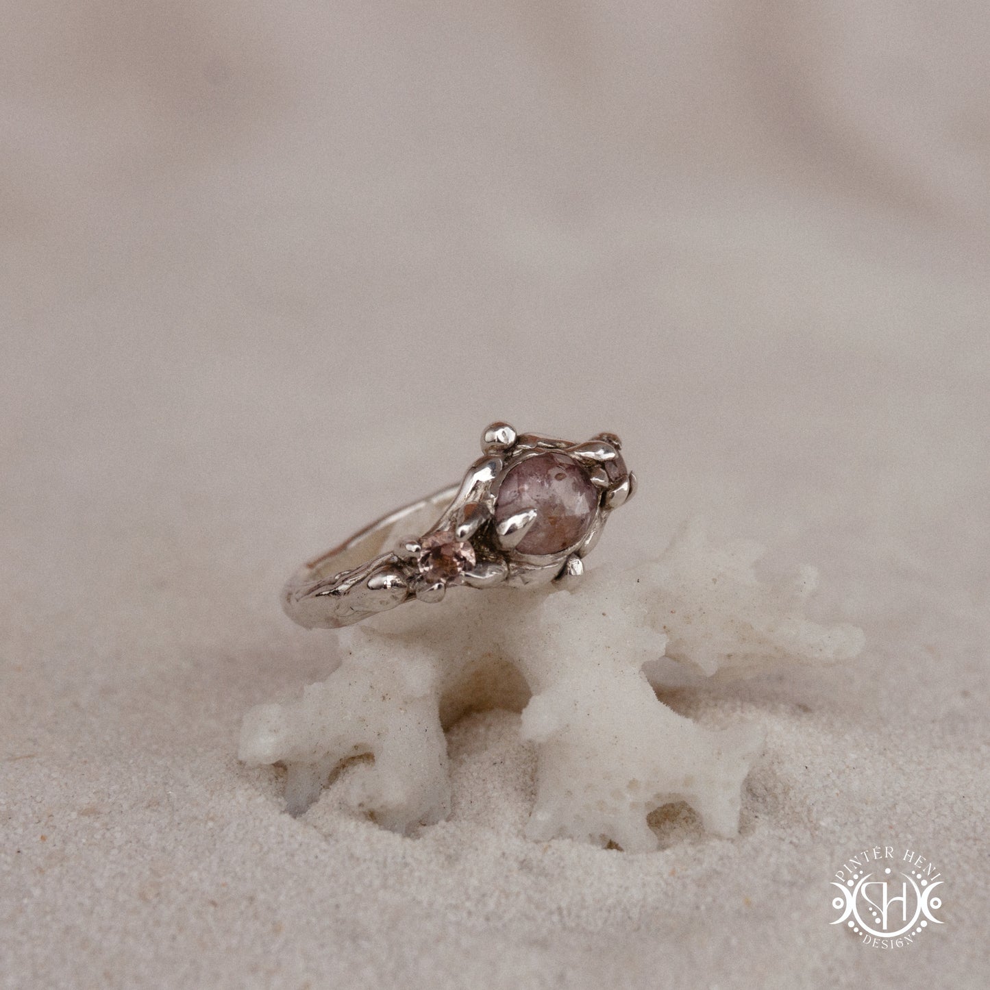 Sterling silver organic ring with pink Burma spinel and pink tourmaline in sculptural setting.