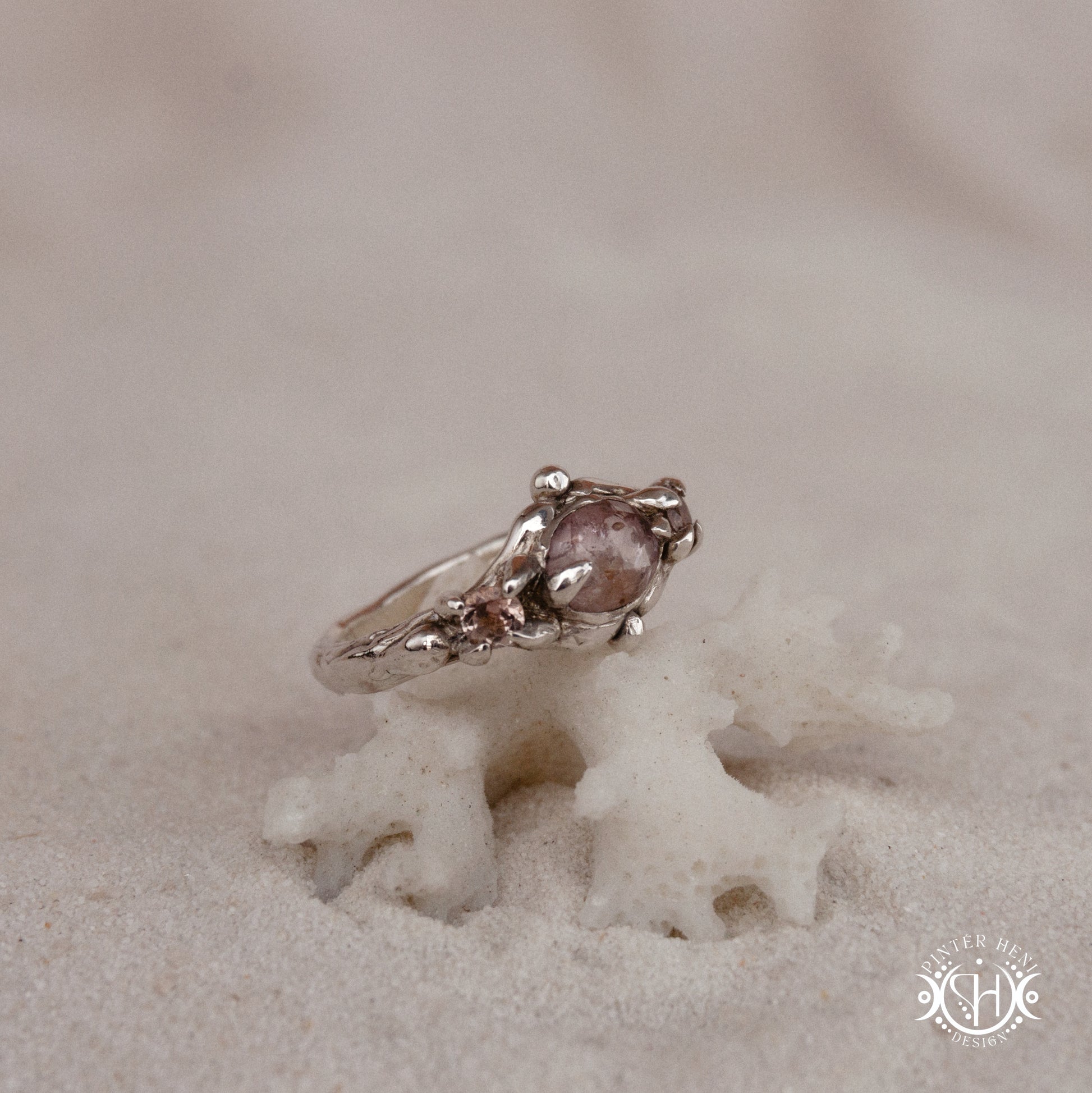 Sterling silver organic ring with pink Burma spinel and pink tourmaline in sculptural setting.