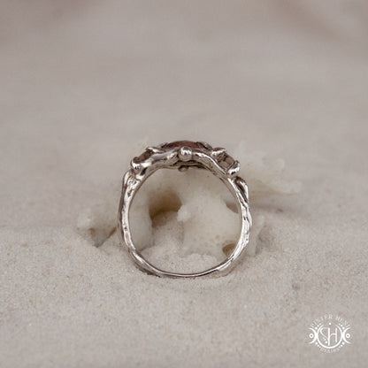 Sterling silver organic ring with pink Burma spinel and pink tourmaline in sculptural setting.