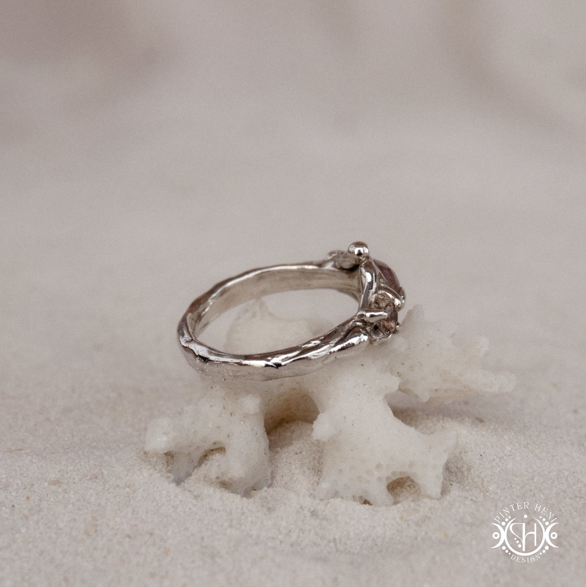 Sterling silver organic ring with pink Burma spinel and pink tourmaline in sculptural setting.