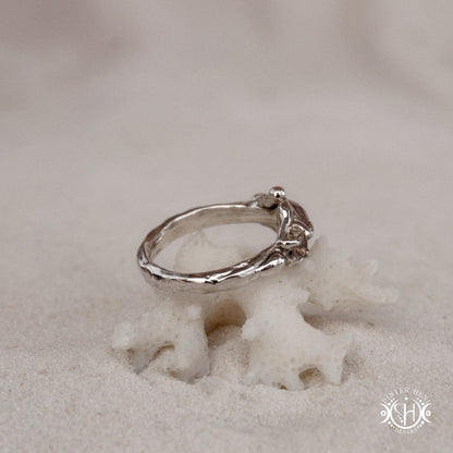 Sterling silver organic ring with pink Burma spinel and pink tourmaline in sculptural setting.