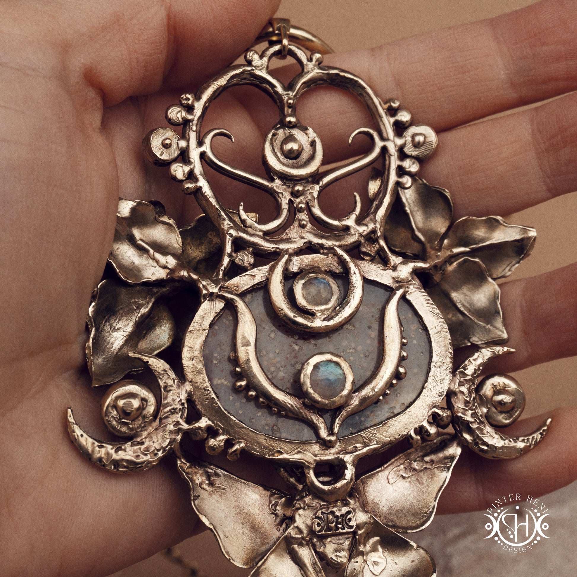 Large sculptural brass statement pendant with stones, inspired by ancient ceremonial forms, Nemetona's Sanctuary necklace.