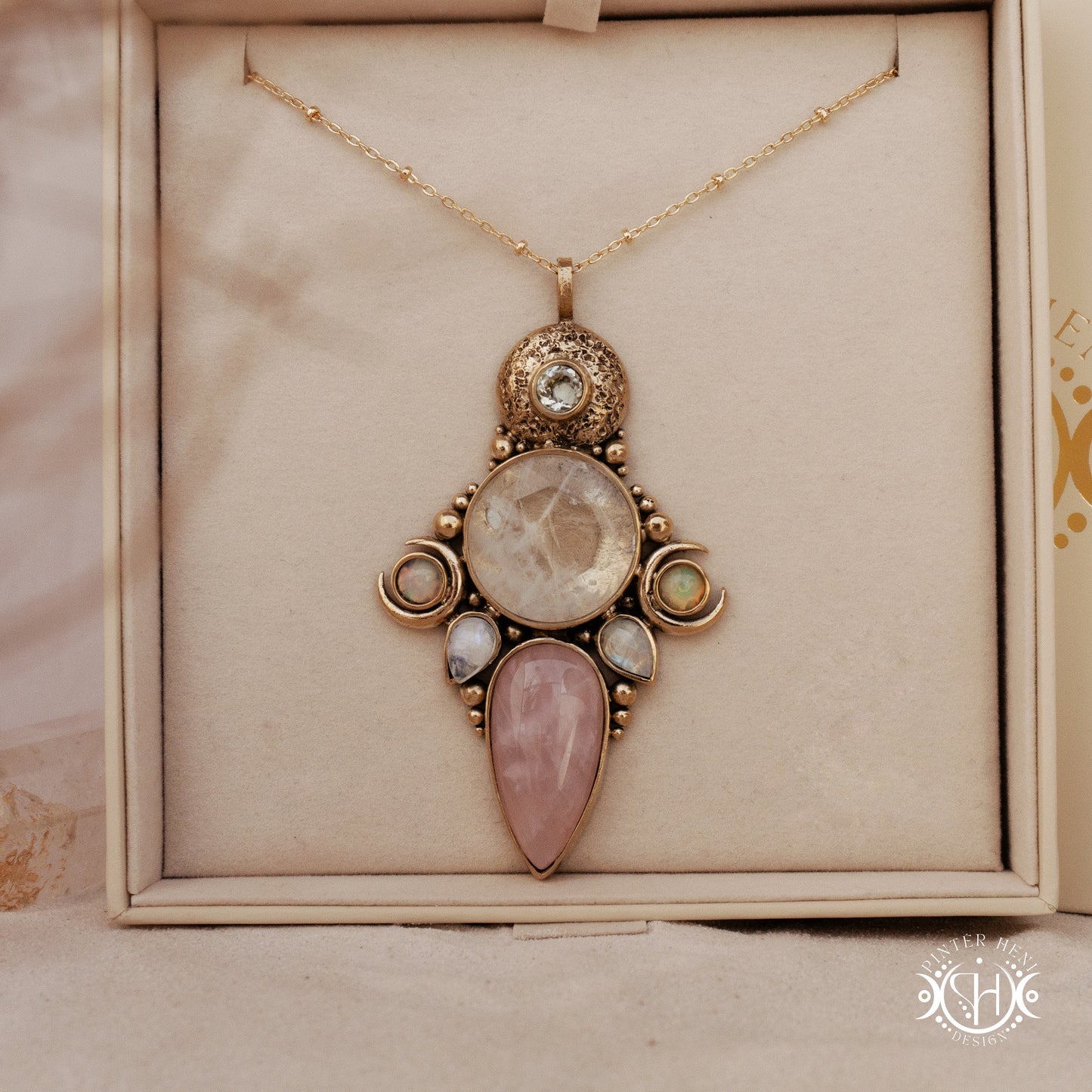 Hand-carved Persephone pendant with opal, moonstone, prasiolite and rose quartz, in branded jewelry box.