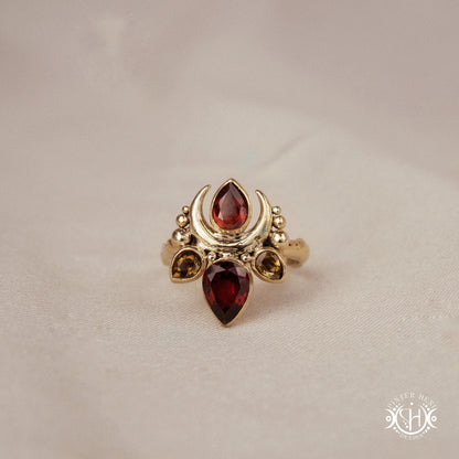Handmade Persephone ring with garnet and green tourmaline in sculptural feminine setting