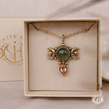 Hand-carved Selene crescent pendant with vesuvianite and morganite.