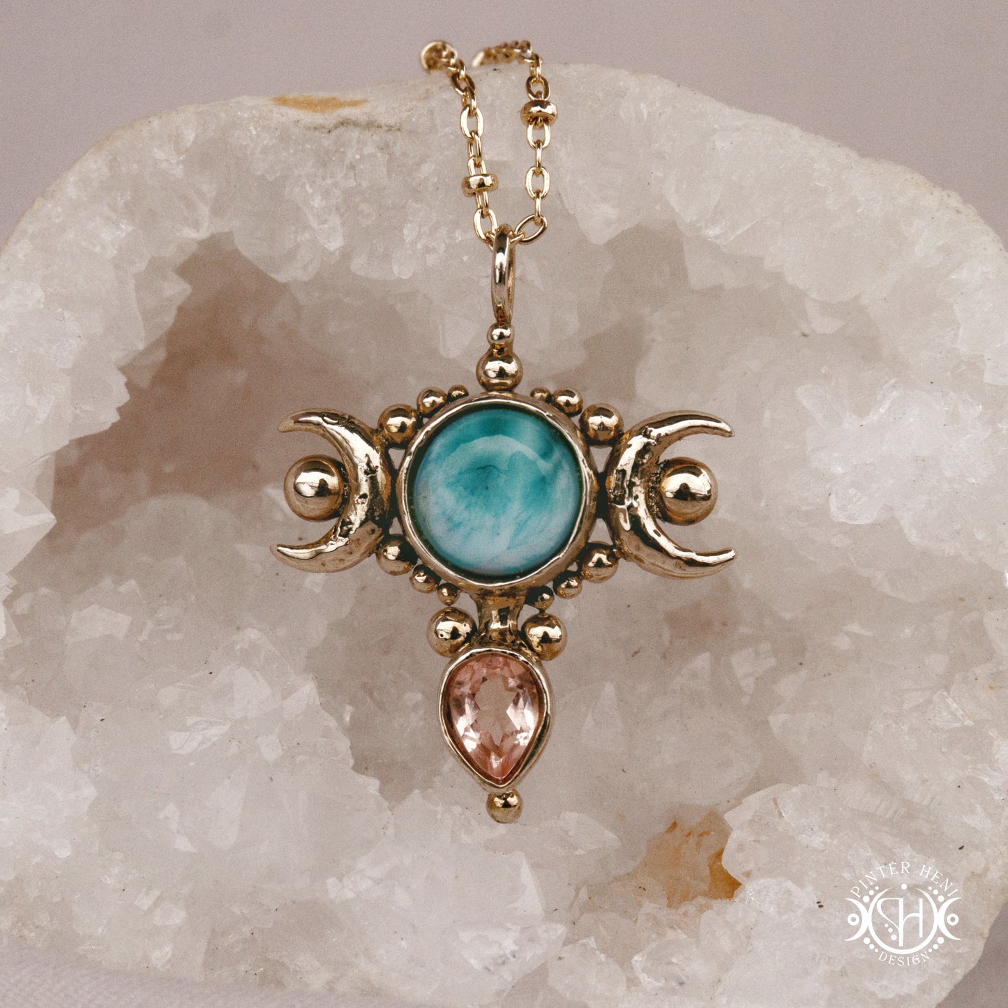 Hand-carved Selene crescent pendant with larimar and morganite.