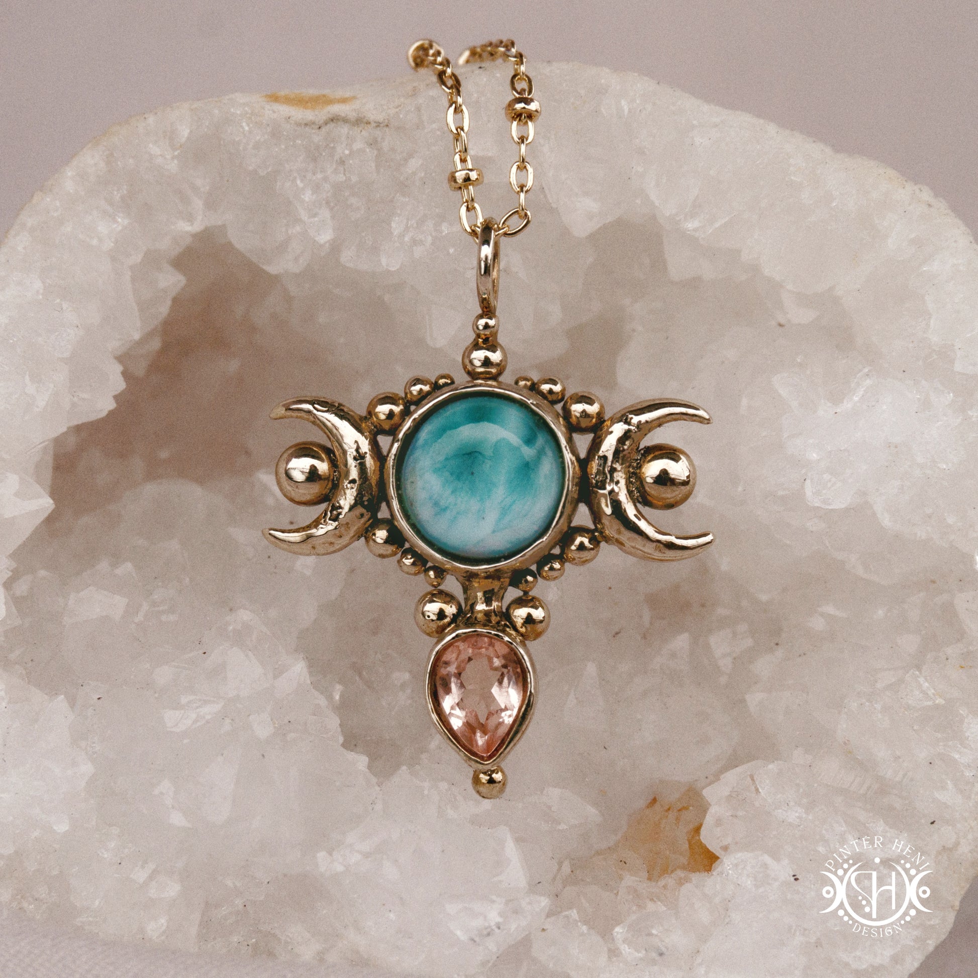 Hand-carved Selene crescent pendant with larimar and morganite.
