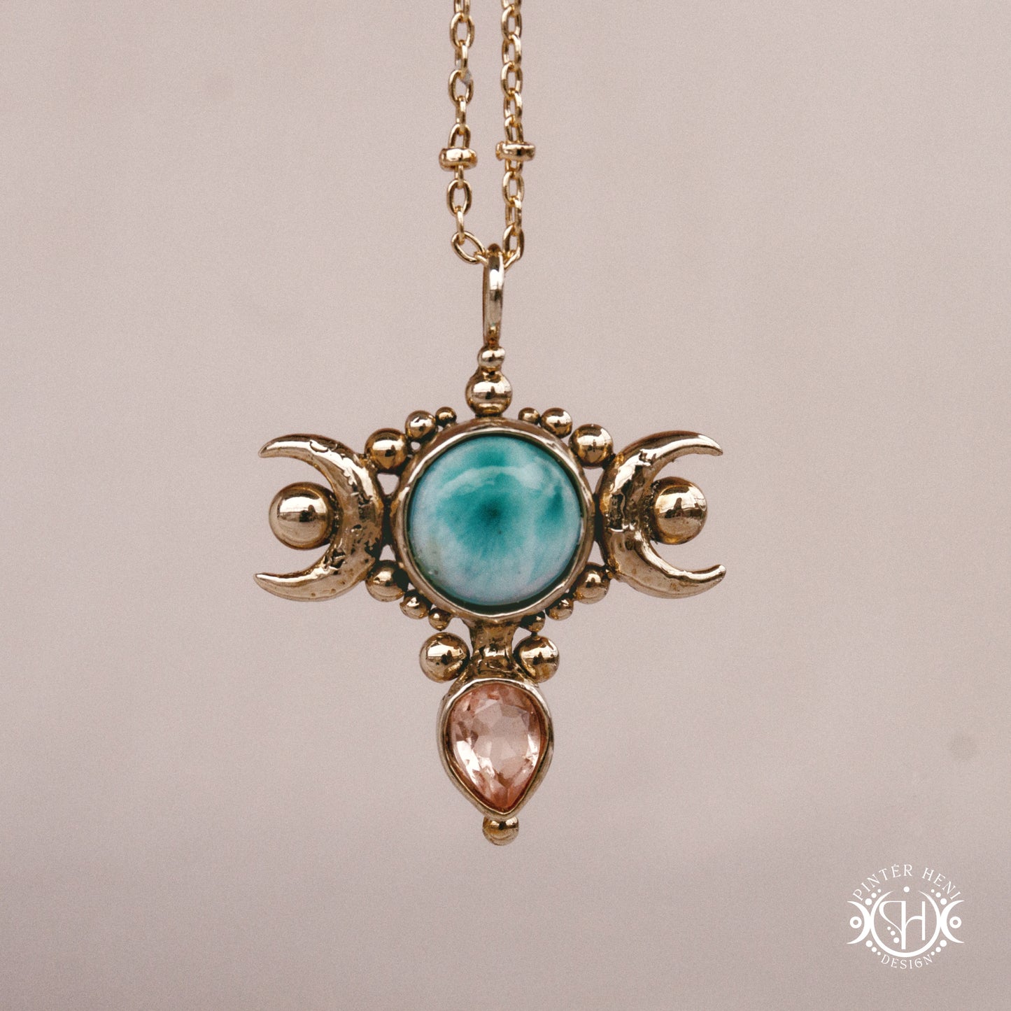 Hand-carved Selene crescent pendant with larimar and morganite.
