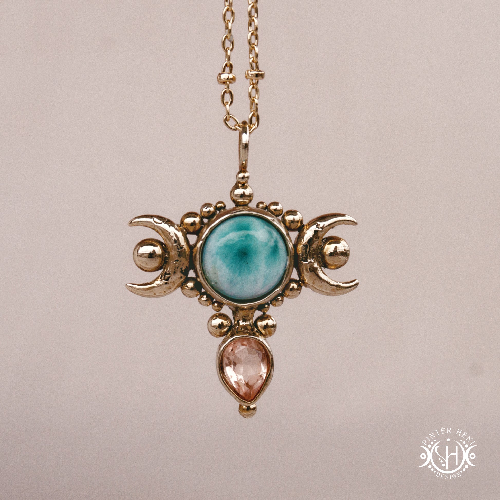 Hand-carved Selene crescent pendant with larimar and morganite.