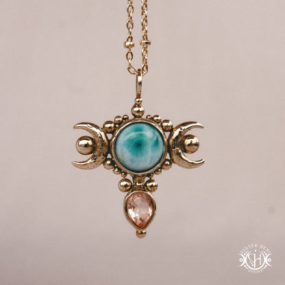Hand-carved Selene crescent pendant with larimar and morganite.