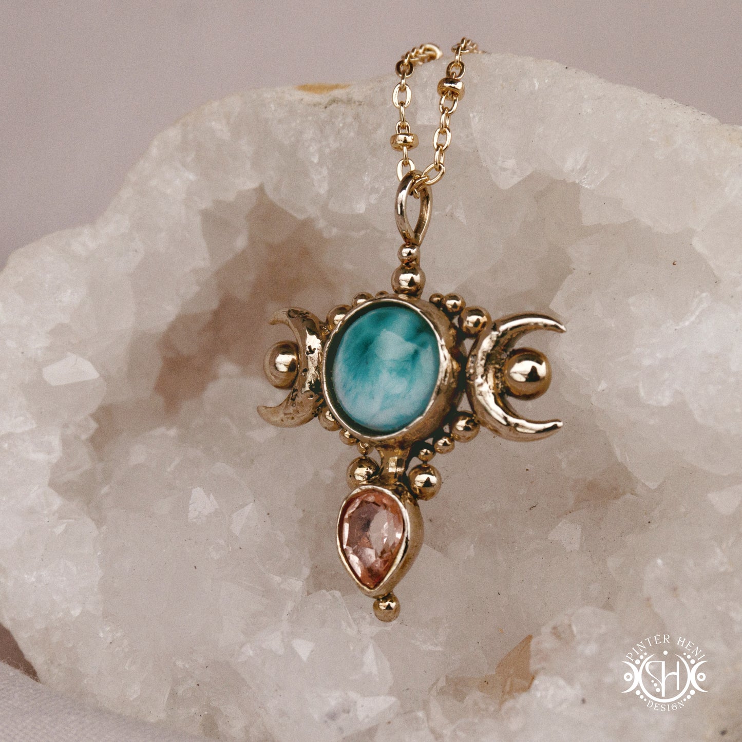 Hand-carved Selene crescent pendant with larimar and morganite.