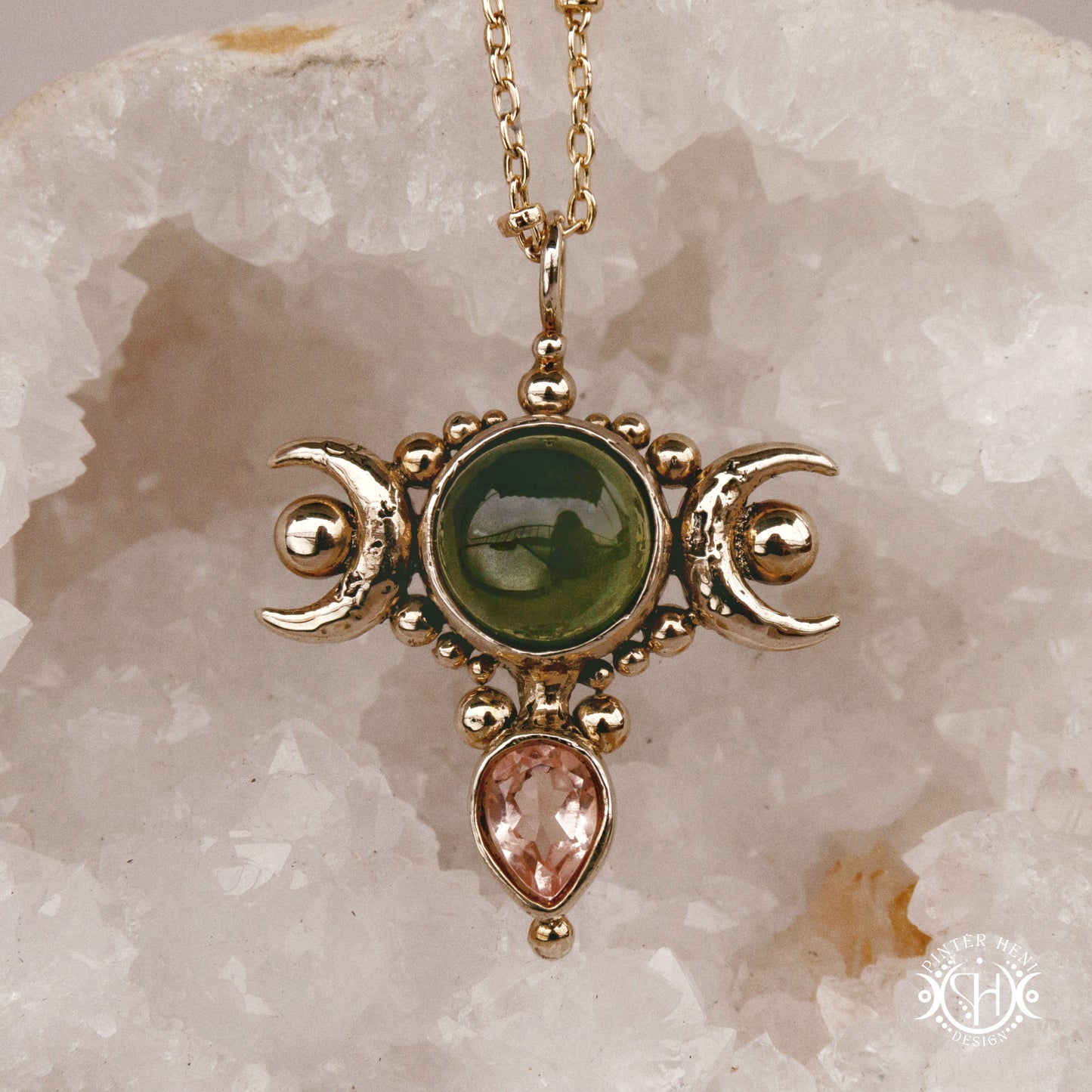 Hand-carved Selene crescent pendant with vesuvianite and morganite.