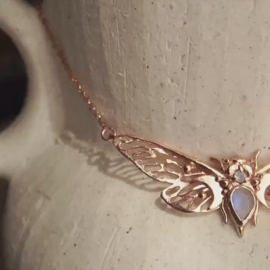 Handcrafted cicada pendant with moonstone in rose gold.