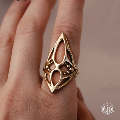 Pulse Ring sculptural axial handmade ring with compact vertical organic form in brass, on hand.