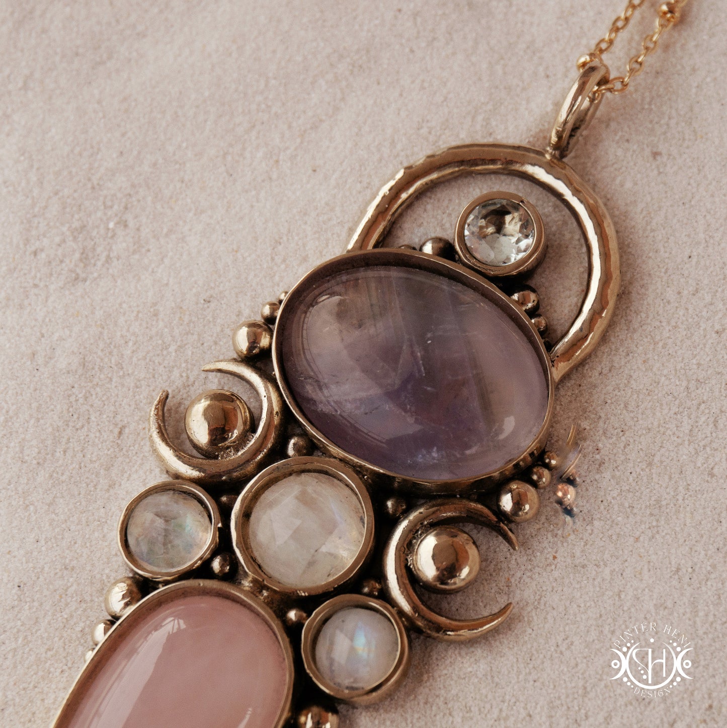 Hand-carved Rhea pendant with rose quartz, amethyst, moonstone and prasiolite. 