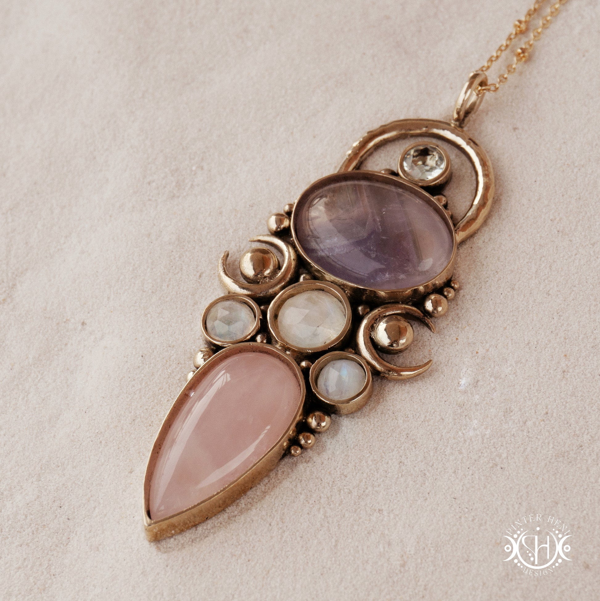 Hand-carved Rhea pendant with rose quartz, amethyst, moonstone and prasiolite.