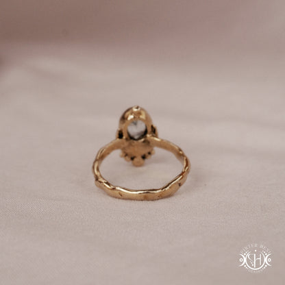 Handmade oval aquamarine gemstone ring set within a crescent-inspired form