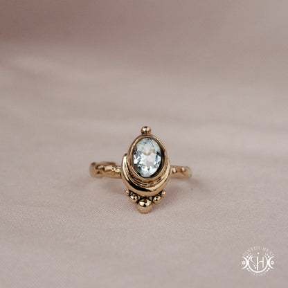 Handmade oval aquamarine gemstone ring set within a crescent-inspired form