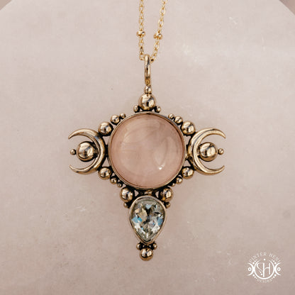 Hand-carved Selene crescent pendant with rose quartz and prasiolite.