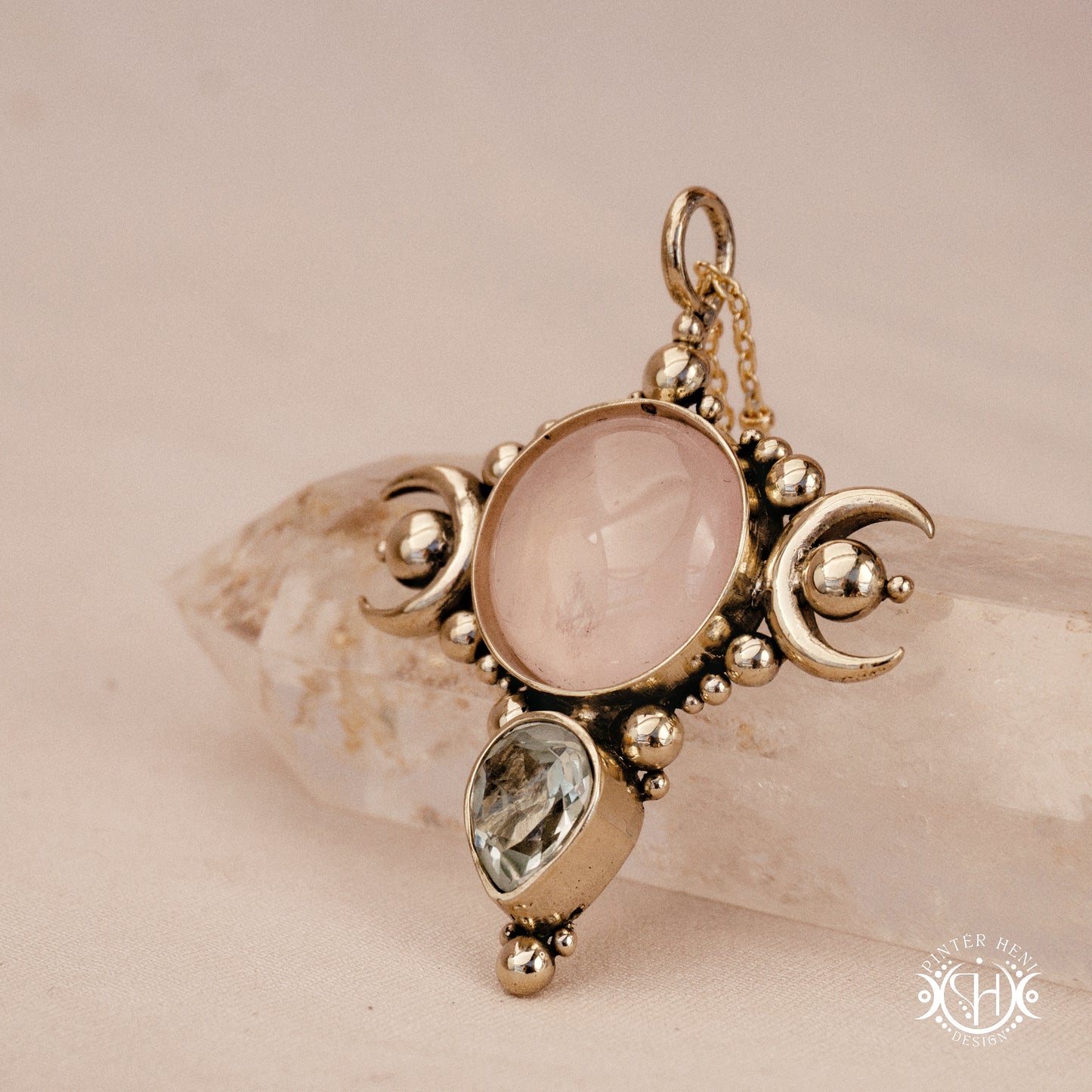 Hand-carved Selene crescent pendant with rose quartz and prasiolite.