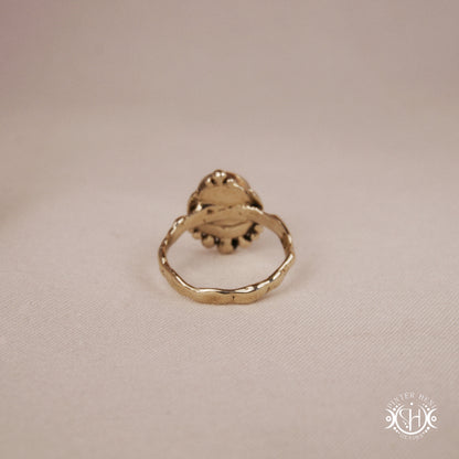 Handmade crescent moon ring with round labradorite set inside the lunar curve