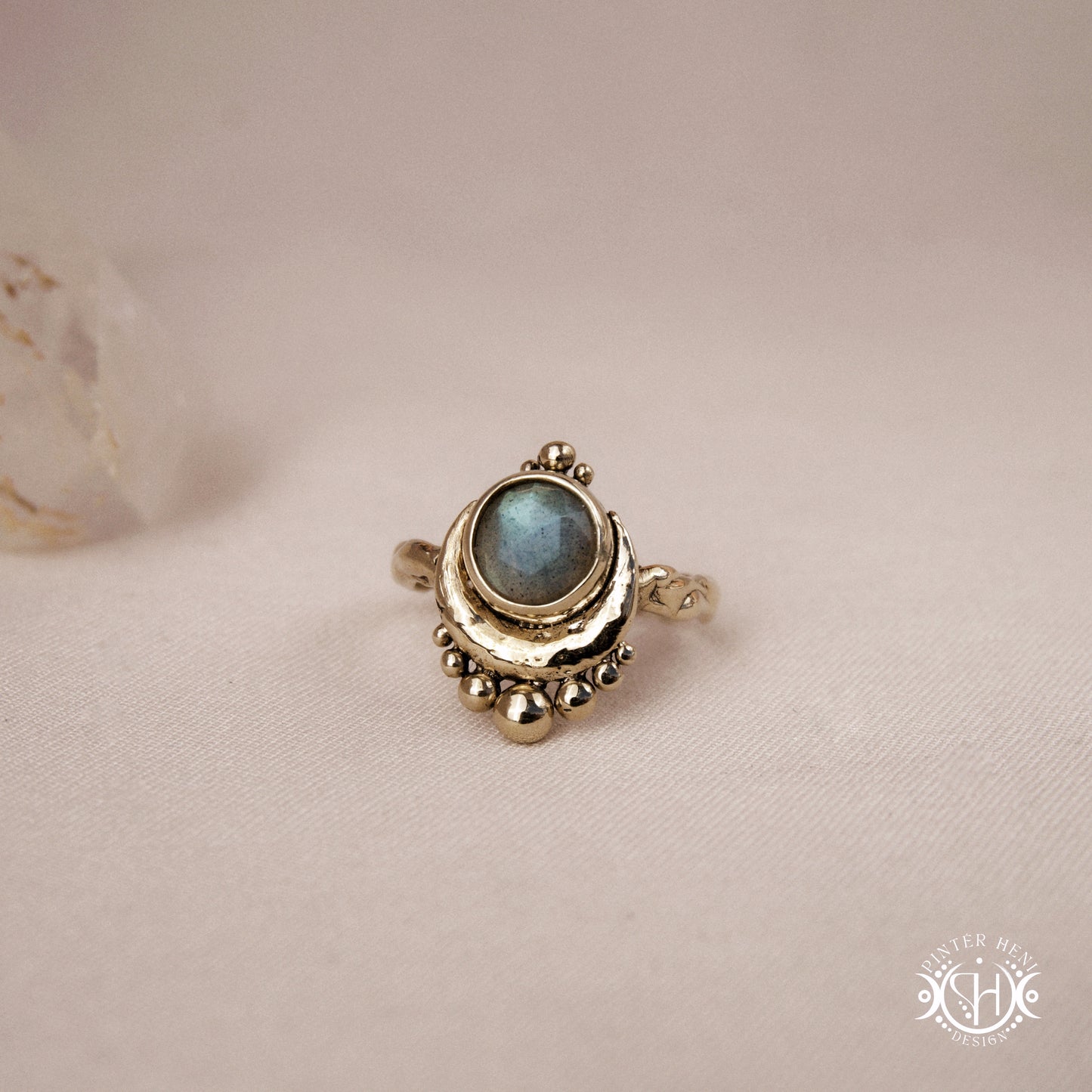 Handmade crescent moon ring with round labradorite set inside the lunar curve
