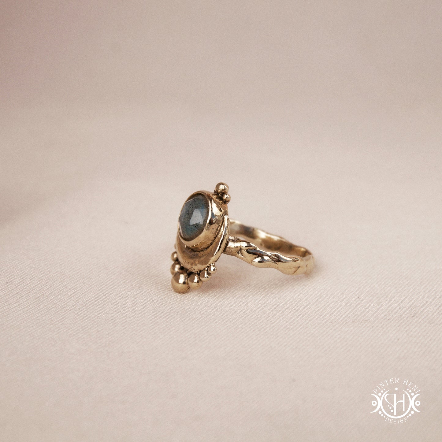 Handmade crescent moon ring with round labradorite set inside the lunar curve