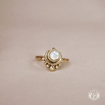 Handmade crescent moon ring with round moonstone set inside the lunar curve