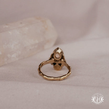 Handmade teardrop ring with morganite and moonstone set in crescent-inspired form