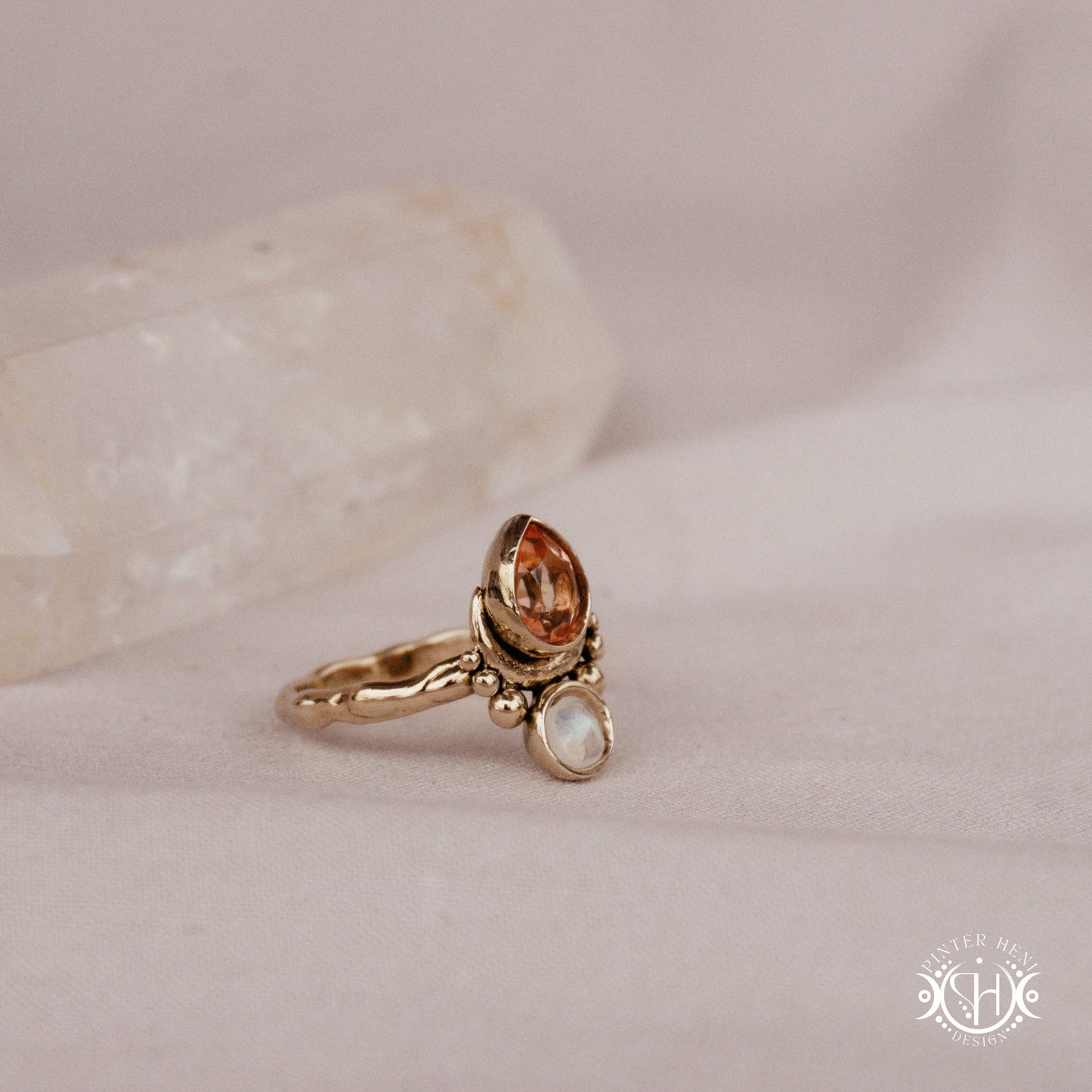 Handmade teardrop ring with morganite and moonstone set in crescent-inspired form