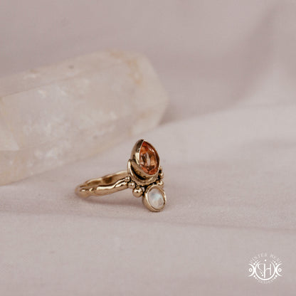 Handmade teardrop ring with morganite and moonstone set in crescent-inspired form