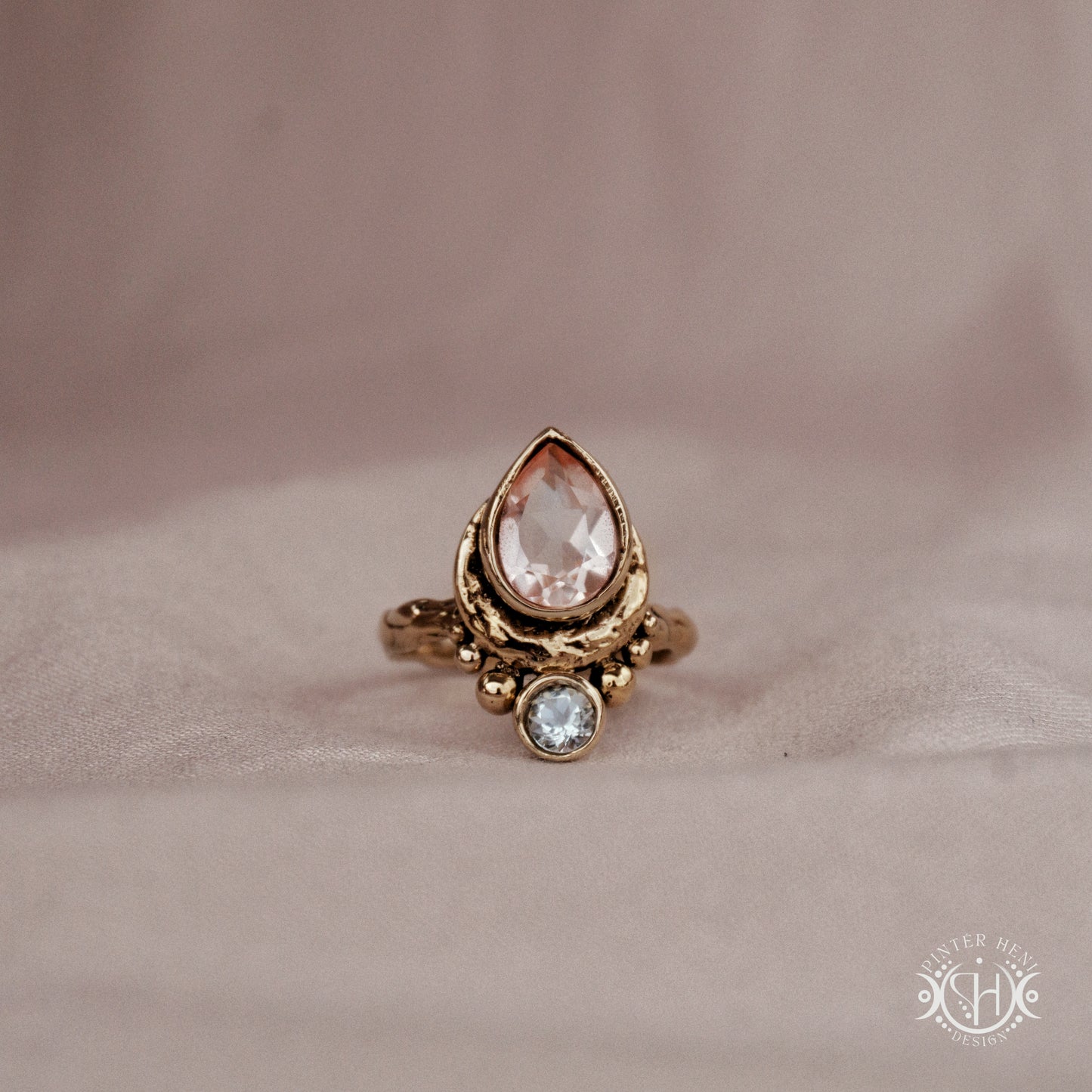 Handmade brass teardrop ring with morganite and aquamarine set in crescent-inspired form