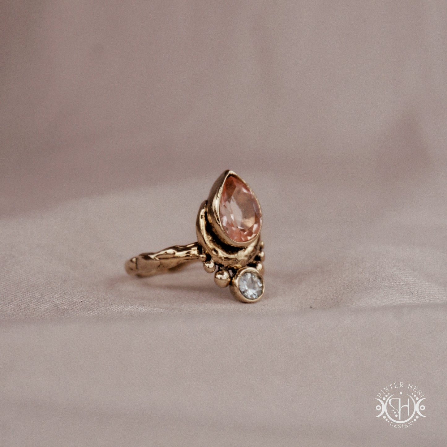 Handmade brass teardrop ring with morganite and aquamarine set in crescent-inspired form