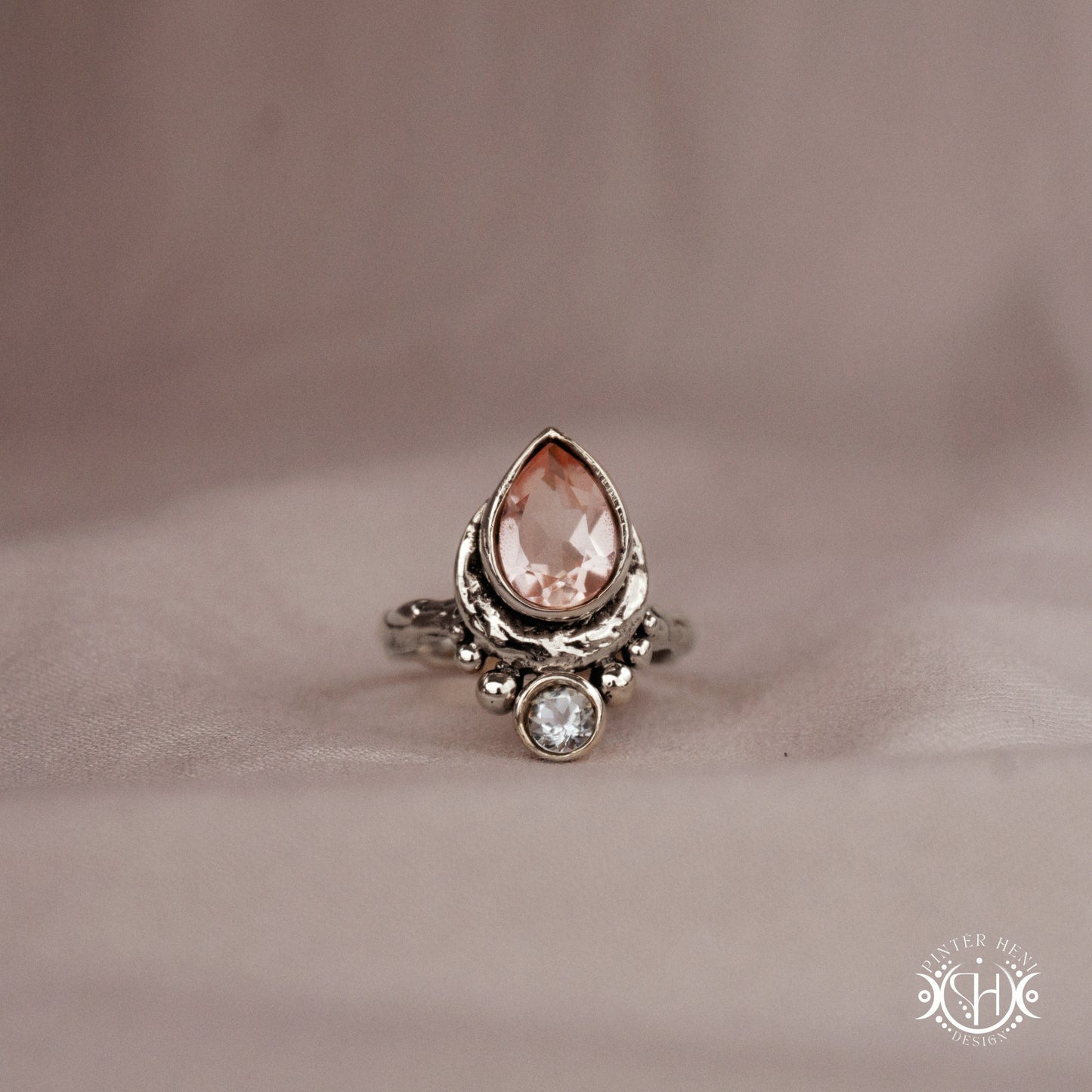 Handmade sterling silver teardrop ring with morganite and aquamarine set in crescent-inspired form
