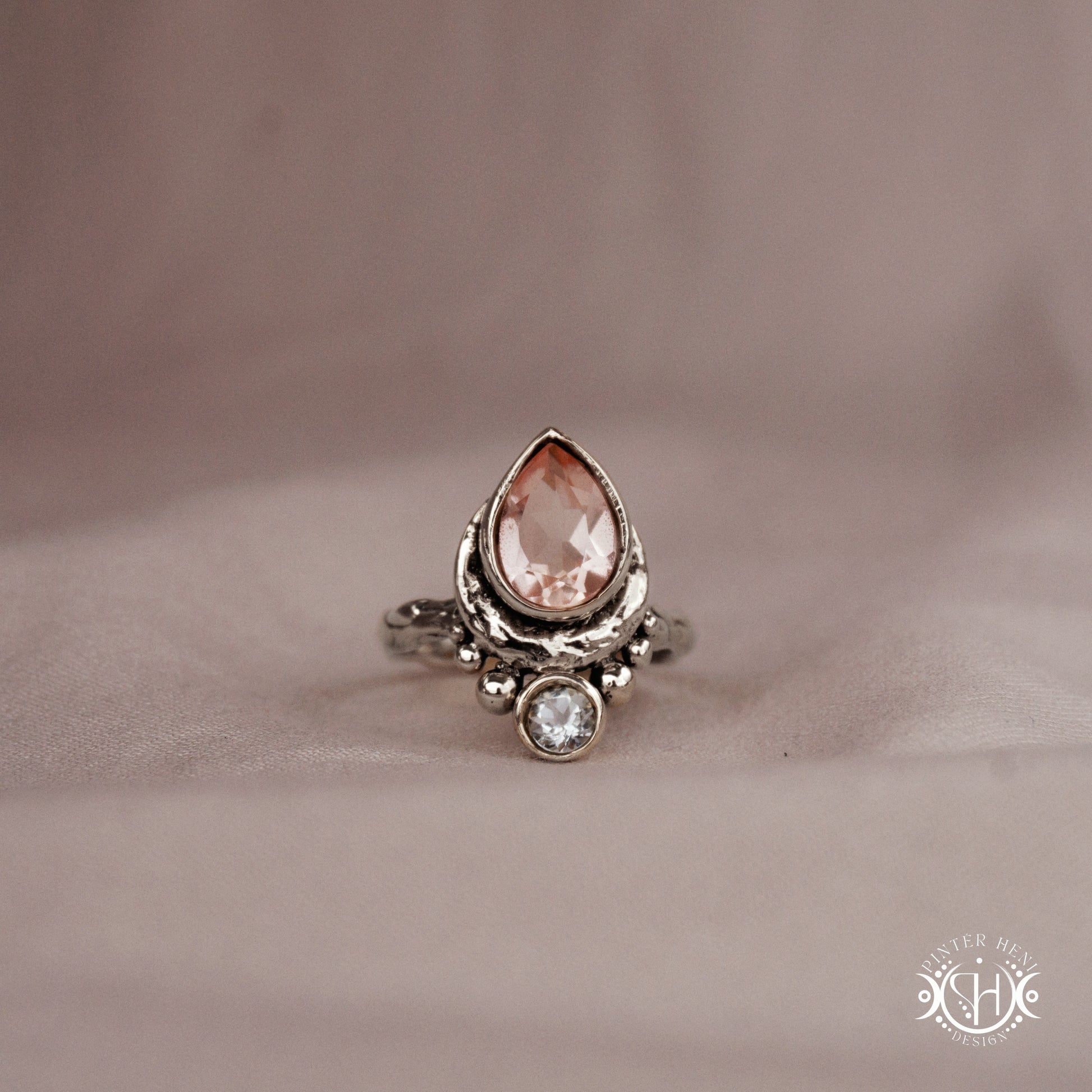 Handmade sterling silver teardrop ring with morganite and aquamarine set in crescent-inspired form