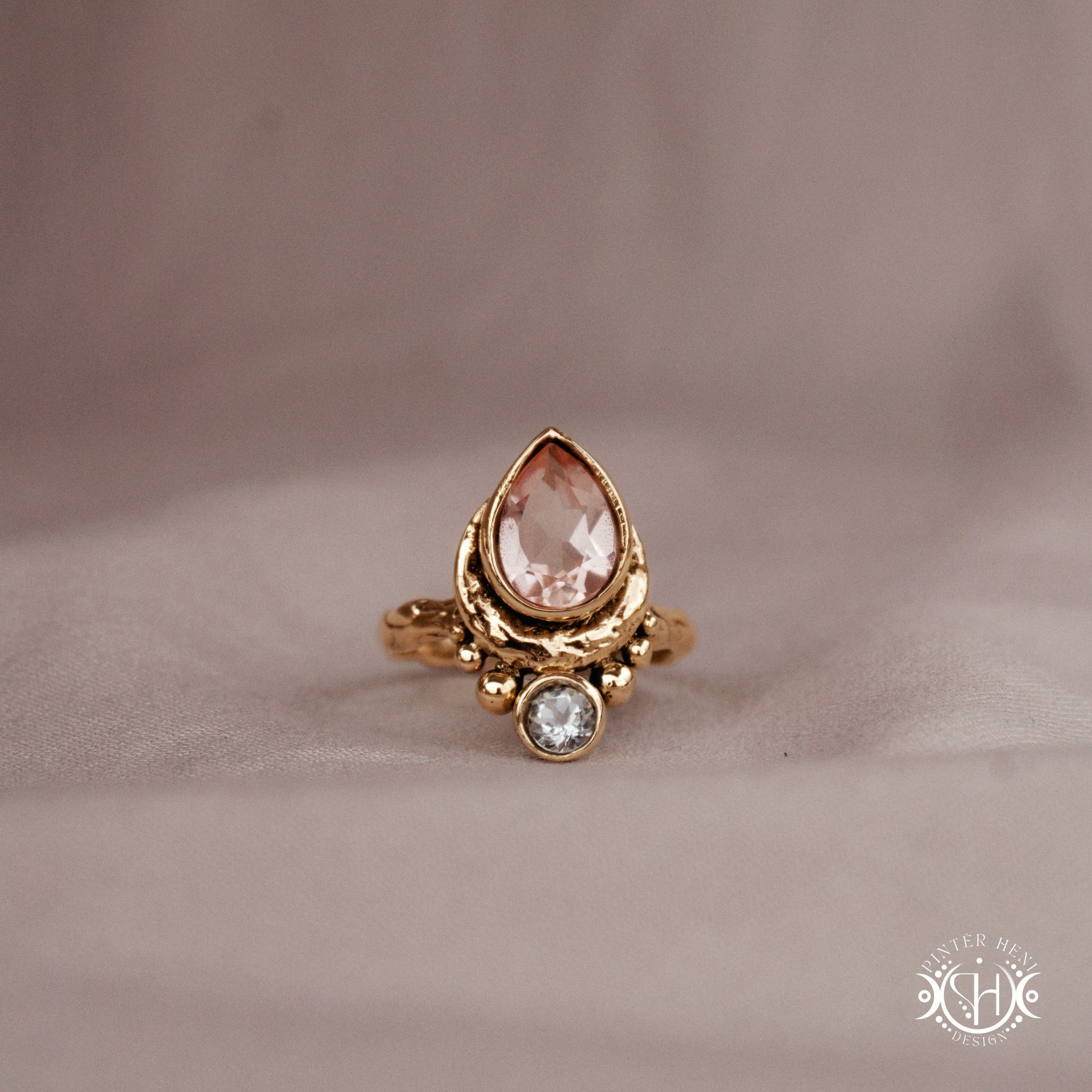 Handmade 24k yellow gold teardrop ring with morganite and aquamarine set in crescent-inspired form